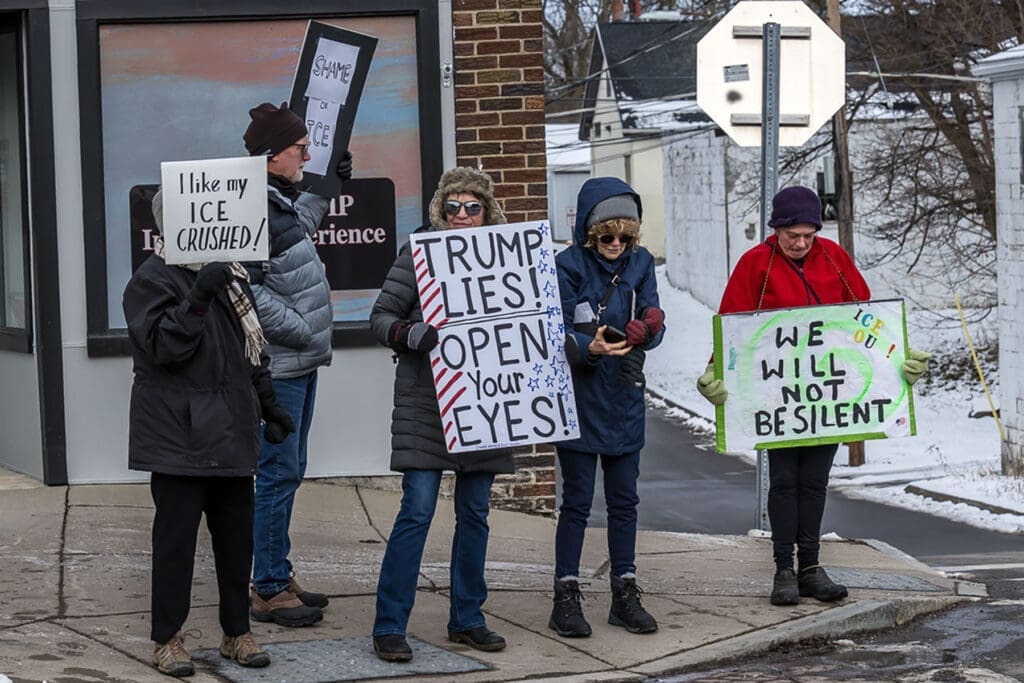 Winter protest with anti-Trump and ICE signs
